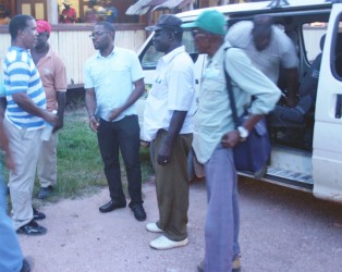 (Left to right) Charles Thom meets Leslie Gonsalves (partially hidden), Regional Chairman Sharma Solomon, Maurice Butters and Stanley Collins on their arrival at the Kwakwani Workers Club last Friday. 