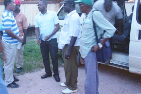 (Left to right) Charles Thom meets Leslie Gonsalves (partially hidden), Regional Chairman Sharma Solomon, Maurice Butters and Stanley Collins on their arrival at the Kwakwani Workers Club last Friday.