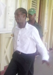 Murder accused Stravo Evans being led to the court yesterday 