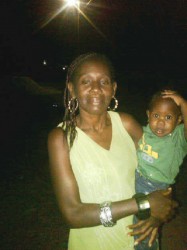 June Ann Harris with her one-year-old son Dequan, who was found dead in a drain in front of their house. 
