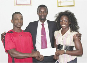 Public Relations Manager of Giftland OfficeMax, Compton Babb (centre) poses with Devon Davis and Alisha Fortune following the company’s sponsorship commitment.