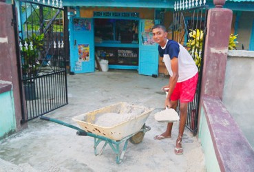 Andrew Rambarran Jr assisting with chores