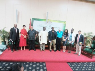 Guyana Prize: President Donald Ramotar (third from left) with from left Al Creighton,  Secretary of the  Management Committee of the Guyana Prize for Literature; Chairman of the Jury, Professor Jane Bryce; UG Vice-Chancellor Jacob Opadeyi; Ruel Johnson; Dr Ian McDonald; Cassia Alphonso; Mosa Mathifa Telford and Chaitaram Singh. 