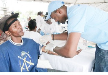 A patient being looked after at the health fair (GINA photo)  