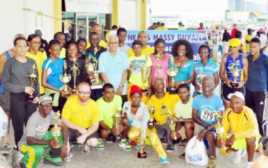 The top three finishers of the various categories with their trophies after the presentation ceremony (Orlando Charles photo).