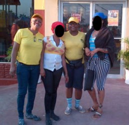 Guyana Women Miners Organisation members Marion Shepherd (at left) and Simona Broomes (second from right), with the women they rescued yesterday 