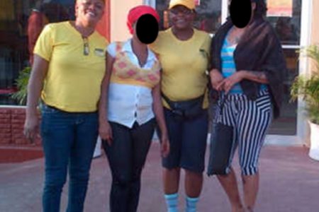Guyana Women Miners Organisation members Marion Shepherd (at left) and Simona Broomes (second from right), with the women they rescued yesterday 