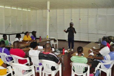 Coach Sampson Gilbert lecturing the participants during yesterday’e opening session. 