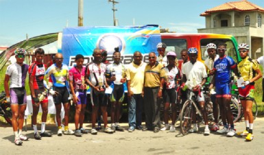  Top Performers! Winners and runners up of yesterday’s Powerade 50-mile road race pose for a photo opportunity at the completion of the event. (Orlando Charles photo) 