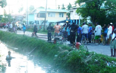 Firemen accessing  water from the trench