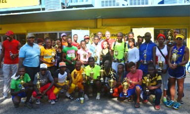 The Courts top five finishers of the various categories with their trophies after the presentation ceremony yesterday morning in front the Courts Main Street branch.