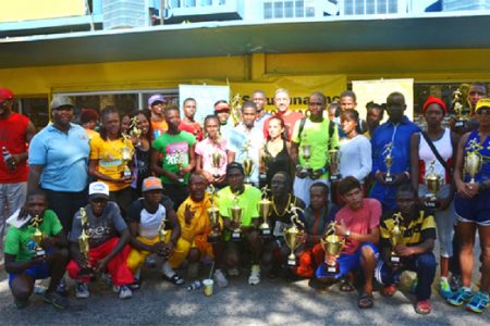 The Courts top five finishers of the various categories with their trophies after the presentation ceremony yesterday morning in front the Courts Main Street branch.