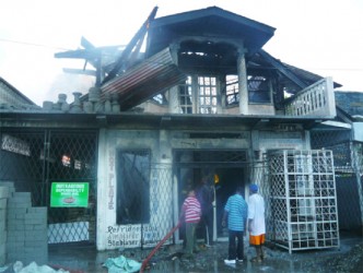 The burnt-out shell of the Double ‘R’ hardware store in Rosignol West Coast Berbice which went up in flames yesterday afternoon. (Photo by Shabna Ullah)