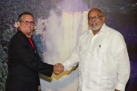 New Cuban Ambassador to Guyana Julio Cesar Gonzalez Marchante (left) shakes hands with President Donald Ramotar after presenting his credentials at the Office of the President yesterday. (GINA photo)