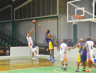 Shelroy Thomas attempting a fade away jumper over Wortmanville/Werk-en-Rust’s Joslyn Crawford. 