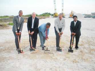 From left: GCCI President Clinton Urling, Executive Vice President & Vice Chairman Unicomer Group Guillermo Siman, Prime Minister Samuel Hinds, Courts CEO Clyde De Haas and Finance Minister Dr Ashni Singh turn the sod for the new distribution centre.