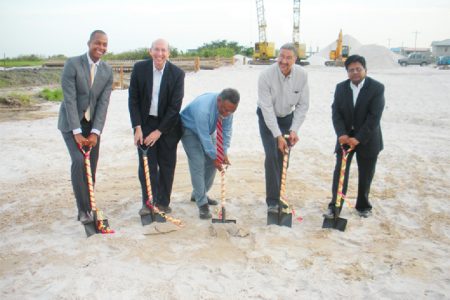 From left: GCCI President Clinton Urling, Executive Vice President & Vice Chairman Unicomer Group Guillermo Siman, Prime Minister Samuel Hinds, Courts CEO Clyde De Haas and Finance Minister Dr Ashni Singh turn the sod for the new distribution centre.