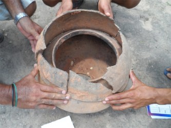 A reconstruction of how the urn was in the ground with the other urn covering it 