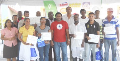 Graduates from Sterling Products Limited’s literacy programme and coordinators and other officials after the graduation exercise 