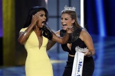  Miss America contestant, Miss New York Nina Davuluri (L) reacts with 2013 Miss America Mallory Hagan after being chosen winner of the 2014 Miss America Pageant in Atlantic City, New Jersey, September 15, 2013. Credit: Reuters/Lucas Jackson 