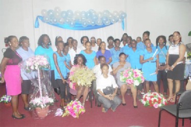 VYC CEO Goldie Scott (first left), graduates from the Women Empowerment Programme (WEP) and teachers (seated centre) smile at the seminar’s closing ceremony. Coordinator of the WEP Keerti Hardowar-Singh is pictured standing at right. 