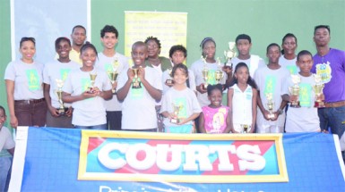 Tournament participants posing with their respective trophies.  