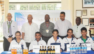 Newly appointed Banks DIH sport ambassadors  (seated from left to right) Christine Sukhram, Neil Reece, Ashley De Groot, Soroya Simmons and Daniel Lopes along with company executives (from left to right) Andrew Carto, Clifford Reis, George McDonald, Michael Pereira and Troy Peters. The sixth ambassador, Stefan Corlette is not in photo. 