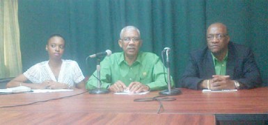 APNU Leader David Granger (centre) flanked by APNU MP Joseph Harmon and PRO Malika Ramsey