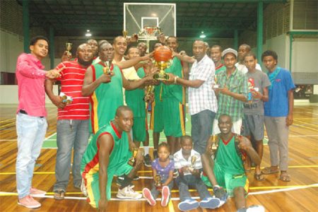 Repeat champions Albouystown/Charlestown posing with the Championship trophy as well as their replicas and individual awards.