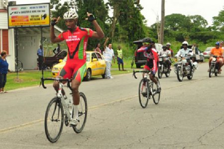 Roraima Bikers Club, Marlon ‘Fishy’ Williams celebrates as he crosses the finish line in yesterday’s 11th annual Victor Macedo road race. (Orlando Charles photo)