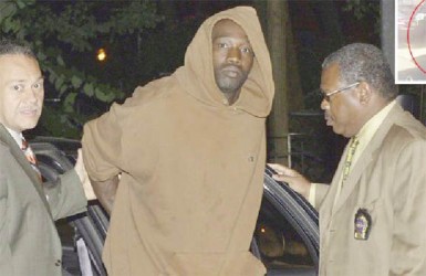 Reginald Chance (centre) about to be charged (New York Post photo) 