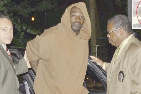 Reginald Chance (centre) about to be charged (New York Post photo)