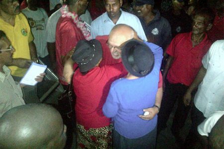 The President embraces some of his supporters after the Rally