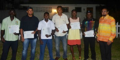 The athletes and officials of the 1SAYG and the Islamic Solidarity Games pose for a photo opportunity yesterday at the Guyana Olympic Association building.