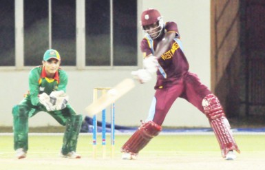 Leroy Lugg bludgeons a delivery through the off side for a boundary. (Orlando Charles photo) 