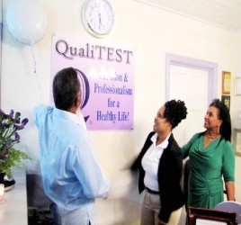 Prime Minister Samuel Hinds and his wife Yvonne Hinds unveil the plaque to the QualiTEST Lab with CEO Yvette Irving (GINA photo) 