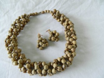 A necklace set designed from seeds by craftswoman Juliana Hughes. Hughes needs help raising money to cover airfare and accommodation to participate in the Crafts of America Festival in Ecuador.