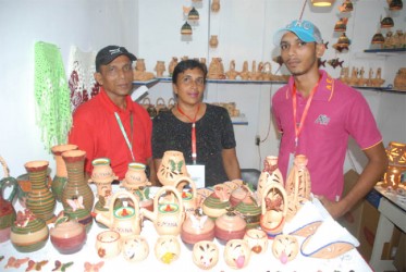 Family entrepreneurship at GuyExpo:  Nandkishore and Sara, proprietors of N&S Andrews, Potters of Wakenaam and their son Jan.