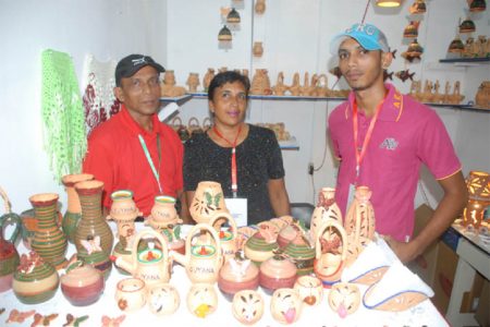 Family entrepreneurship at GuyExpo:  Nandkishore and Sara, proprietors of N&S Andrews, Potters of Wakenaam and their son Jan.