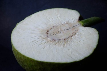 Cut the breadfruit lengthways to make stretch-out breadfruit (Photo by Cynthia Nelson) 