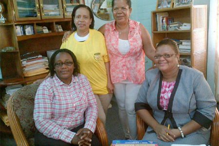 President of the GWMO Simona Broomes, seated at left, along with GWMO US member Sonja Fiedtkou-Perry and local member Dana Jones with Head of the Carnegie School of Economics Penelope Harris, seated at right, during initial talks on the training of women miners at the organization