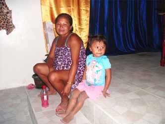 A pregnant Leslyn Joseph and her daughter at Isseneru. 