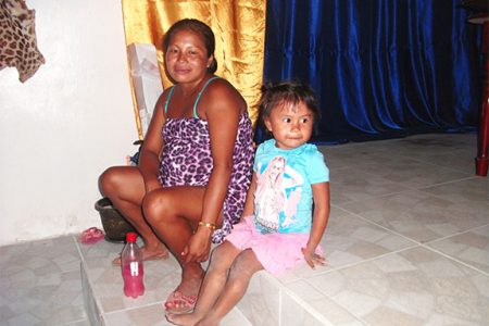 A pregnant Leslyn Joseph and her daughter at Isseneru. 