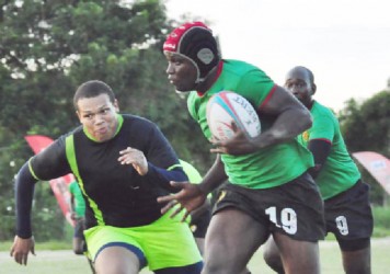 Avery Corbin evades Rondel Mc Arthur to record one of his two tries in the final of yesterday’s Banks Sevens Championships. (Orlando Charles photo)