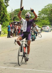 Golden Boy! Junior Sportsman of the Year, Paul DeNobrega celebrates as he is about to cross the finish line in yesterday’s the second annual Kadir Mohamed Memorial Ounce of Gold road race. (Orlando Charles photo)