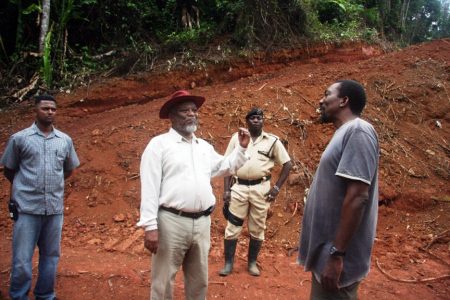 Over the weekend, Prime Minister Samuel Hinds (centre) visited several mining communities along the Mazaruni and Kurupung rivers, Region Seven where he met with residents and miners, according to GINA. Here he chats with a miner. (GINA photo)