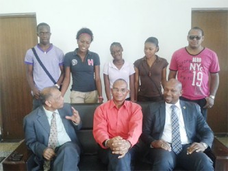 The five SVG students (standing pose with Agriculture Ministers Dr Leslie Ramsammy (left) and Sabato Caesar (right) and another local official.