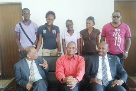 The five SVG students (standing pose with Agriculture Ministers Dr Leslie Ramsammy (left) and Sabato Caesar (right) and another local official.