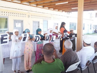 Children displaying an acrostic on Eid-ul-Adha 