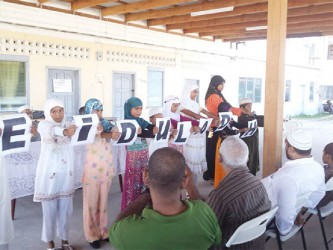 Children displaying an acrostic on Eid-ul-Adha
